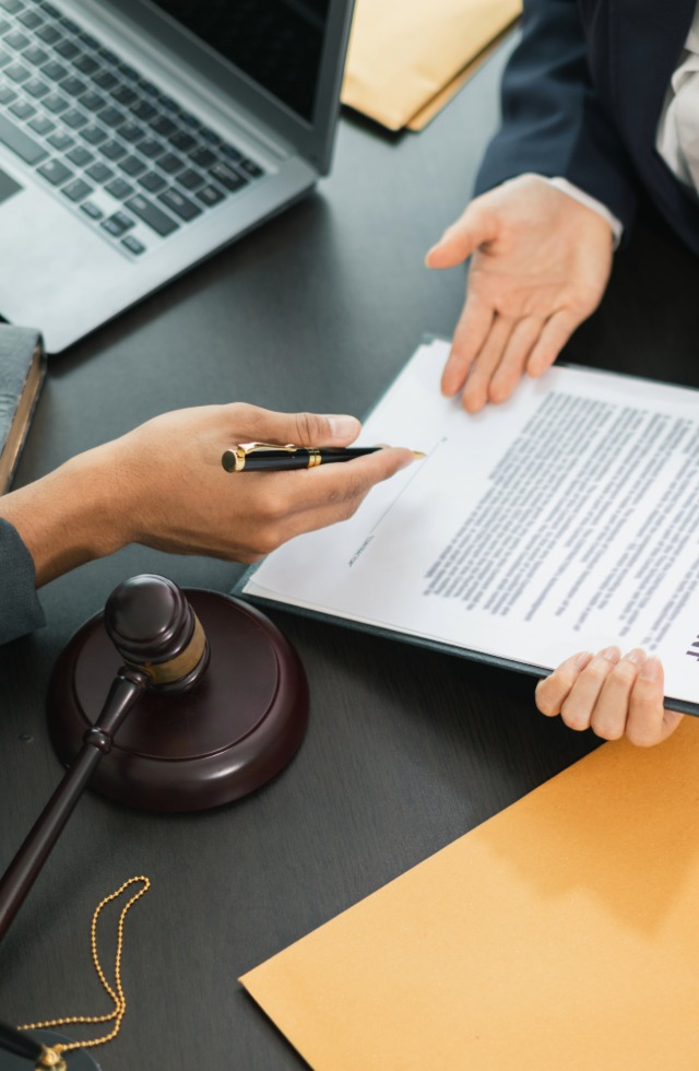 Attorney reviewing an injury case form and intake paperwork