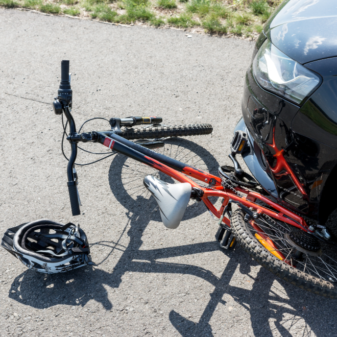 Bicycle collision damage near a car