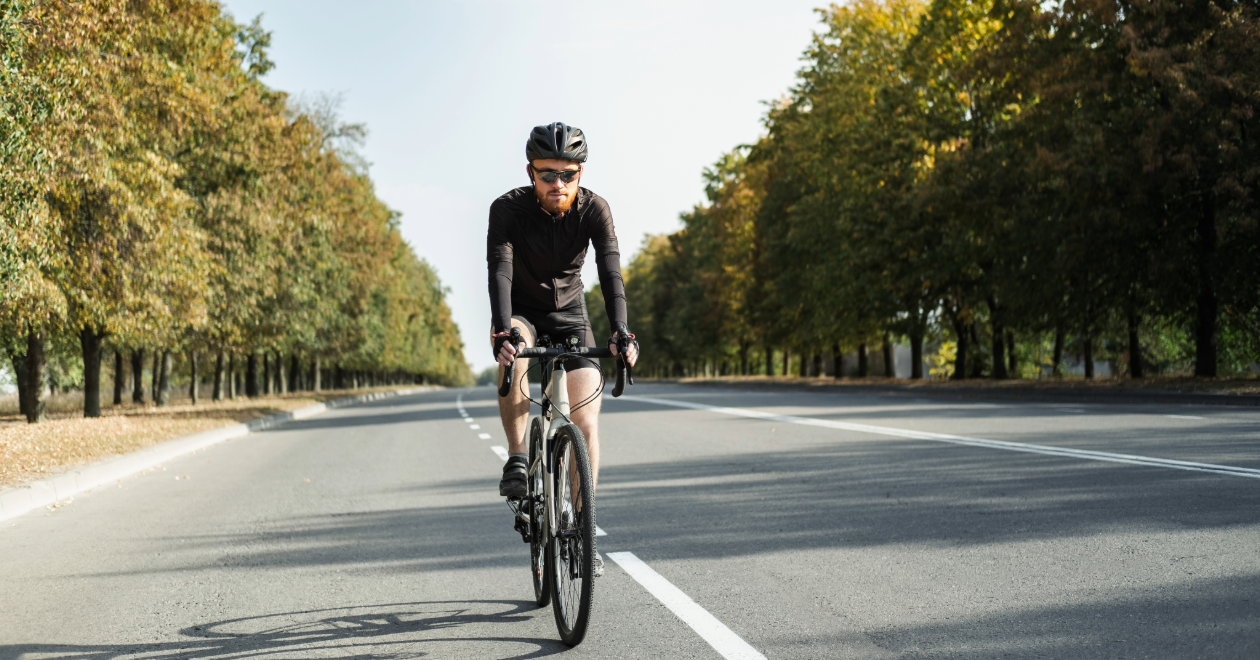 Road cyclist riding on a tree-lined New Jersey street