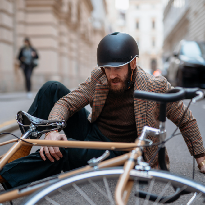Urban cyclist riding between cars