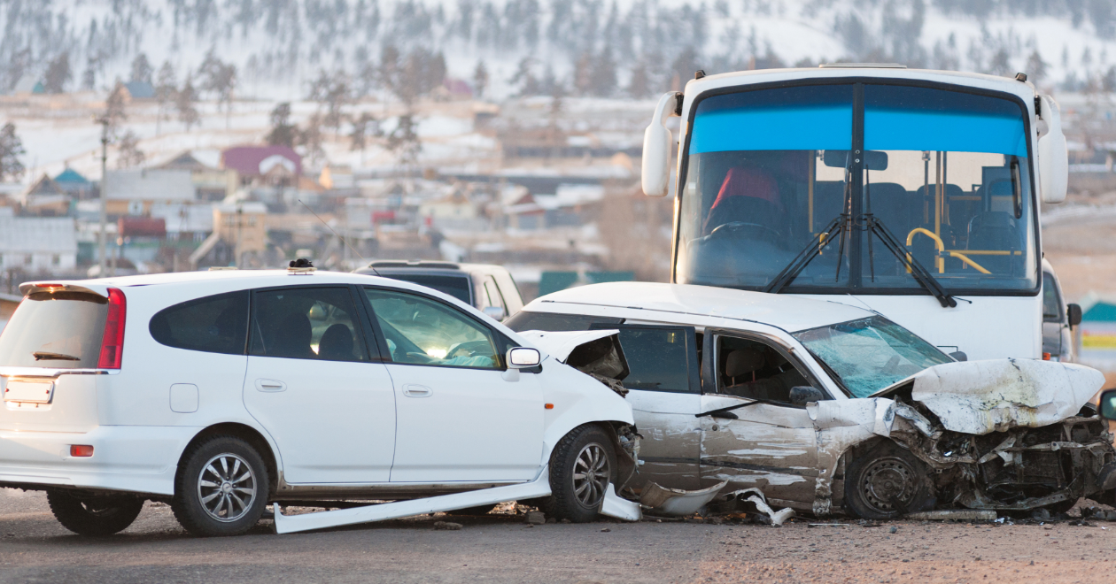Bus and white car collision on the roadside