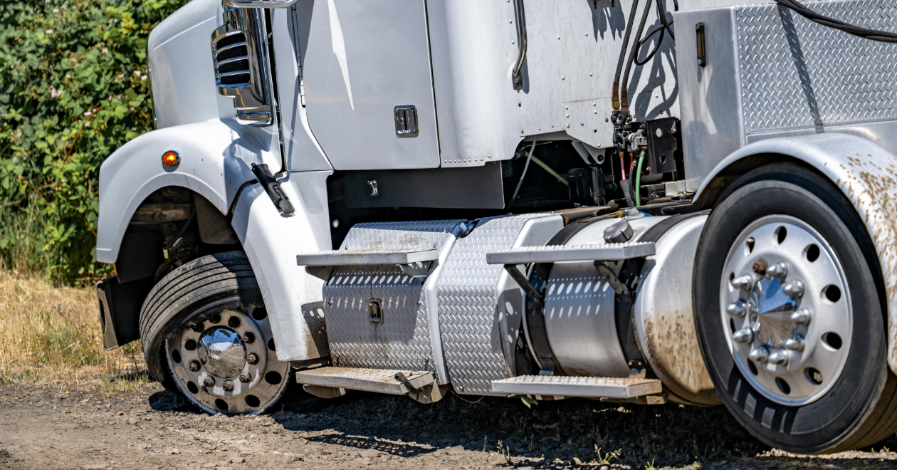 Semi-truck wheel and undercarriage crash damage