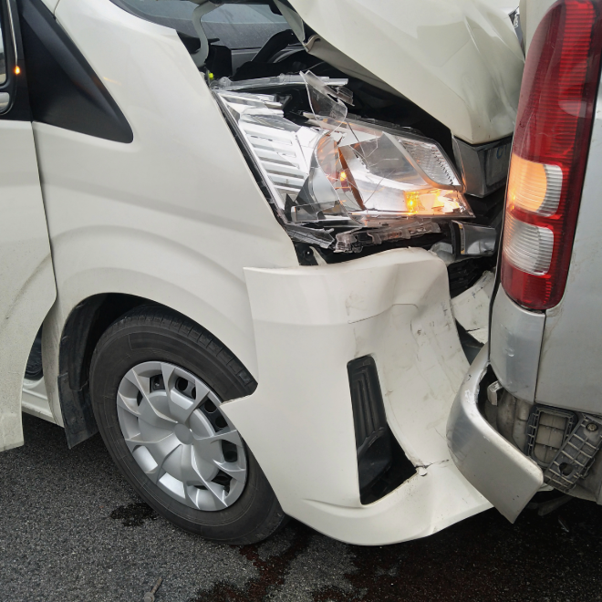 White delivery van rear-end crash damage