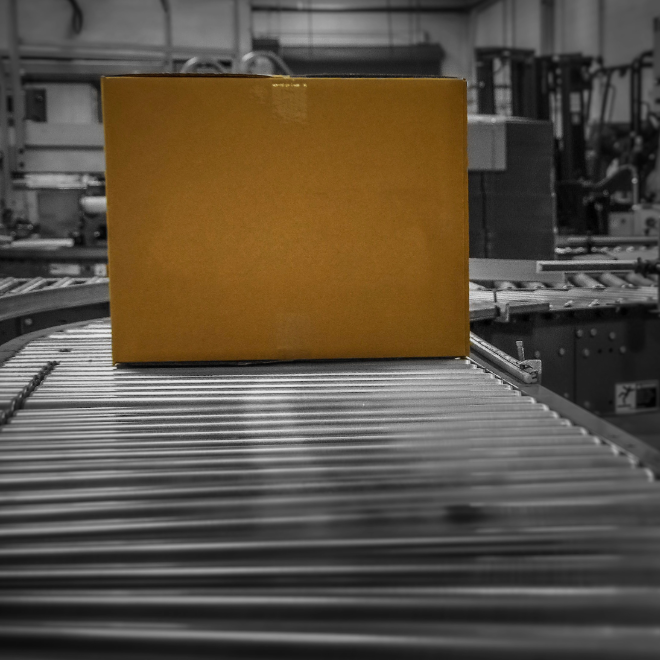 Cardboard package on a warehouse conveyor