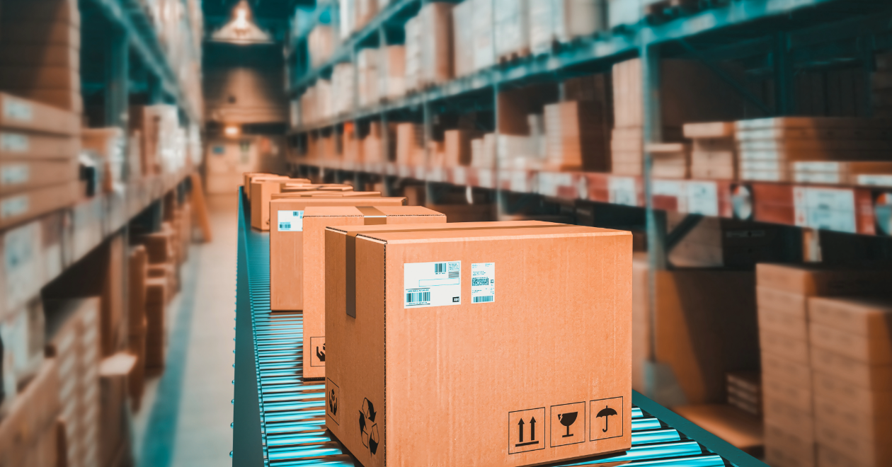 Package moving through a warehouse sorting conveyor
