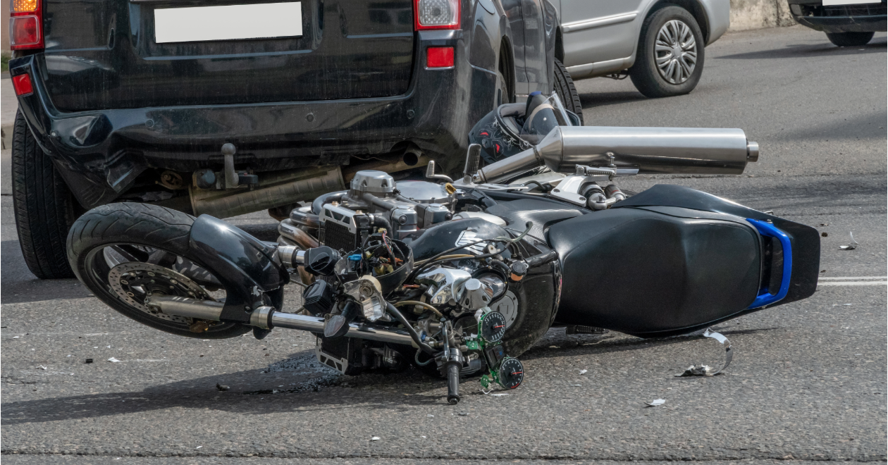 Motorcycle crash beside a van
