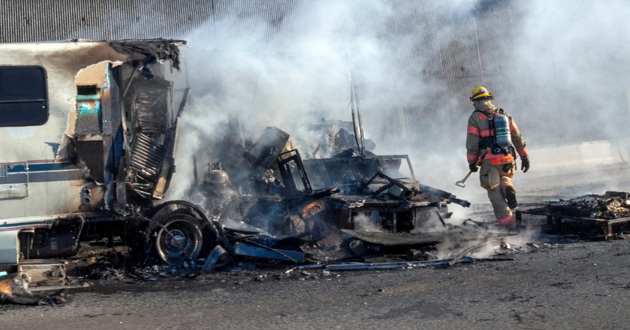 Firefighter at an RV fire crash scene