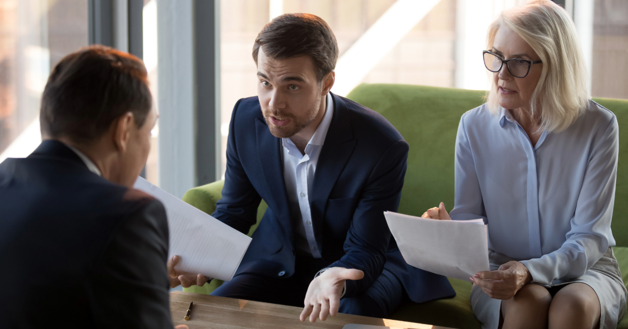 Couple meeting with an attorney about a claim