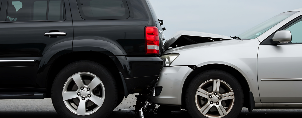 Rear-end collision impact between an SUV and a silver car