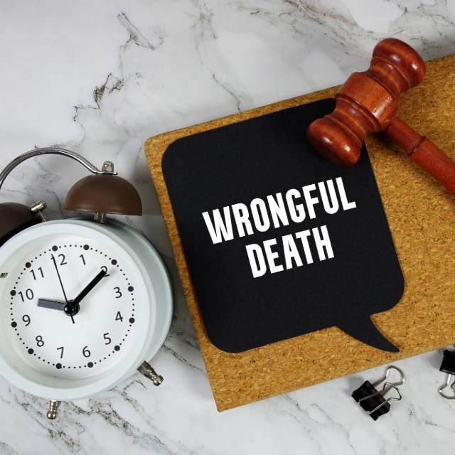 Wrongful death claim documents being reviewed for a serious injury case